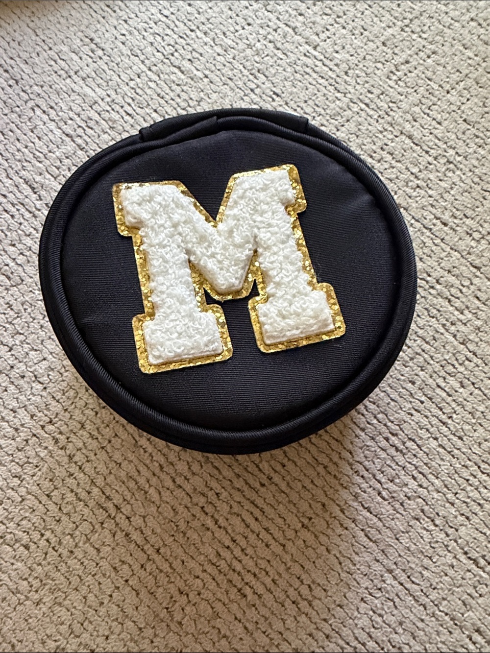 Round Black Case with White & Gold 'M' Patch NWT